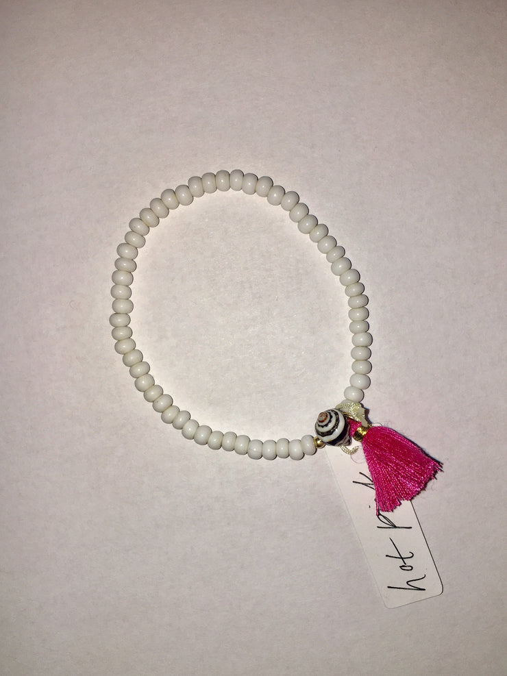 Beaded Bracelet with White Bone Beads, Pyrene Shell and Tassel