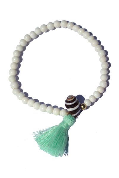 Beaded Bracelet with White Bone Beads, Pyrene Shell and Tassel